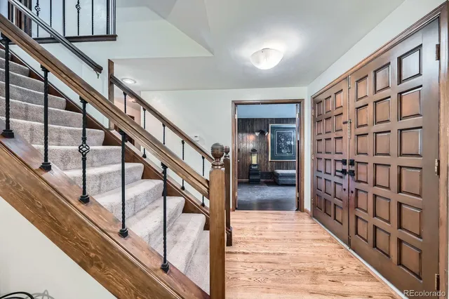 a view of staircase with white walls and stairs