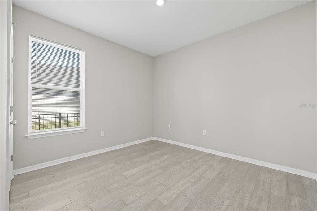 12556 Ryegrass Loop Parrish, FL 34219 - Photo 36 of 49 an empty room with a window