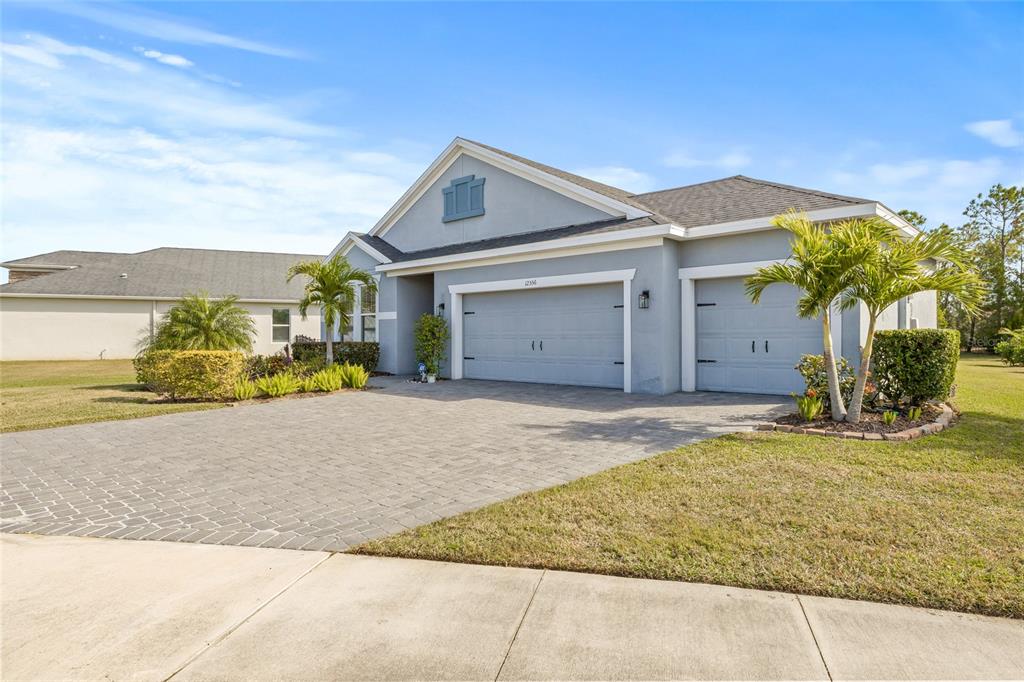 12556 Ryegrass Loop Parrish, FL 34219 - Photo 4 of 49 a view of a house with a outdoor space