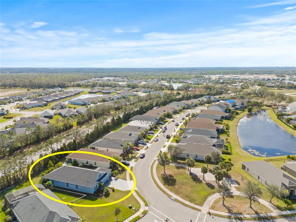 12556 Ryegrass Loop Parrish, FL 34219 - Photo 45 of 49 an aerial view of a house with swimming pool and ocean view