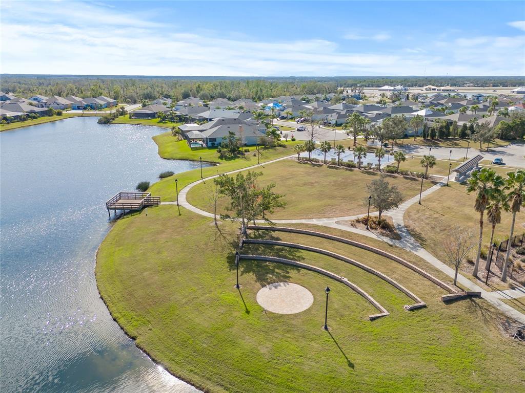 12556 Ryegrass Loop Parrish, FL 34219 - Photo 46 of 49 a view of a swimming pool with an ocean view