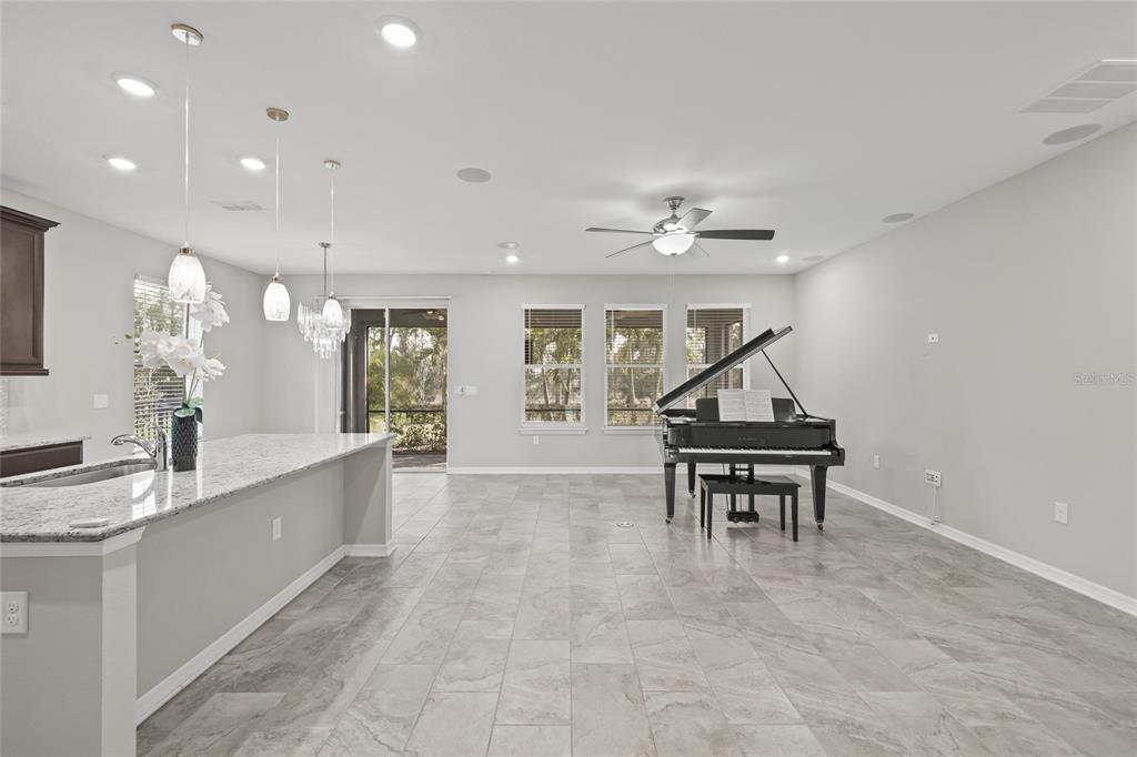 12556 Ryegrass Loop Parrish, FL 34219 - Photo 8 of 49 a view of kitchen with sink and breakfast area