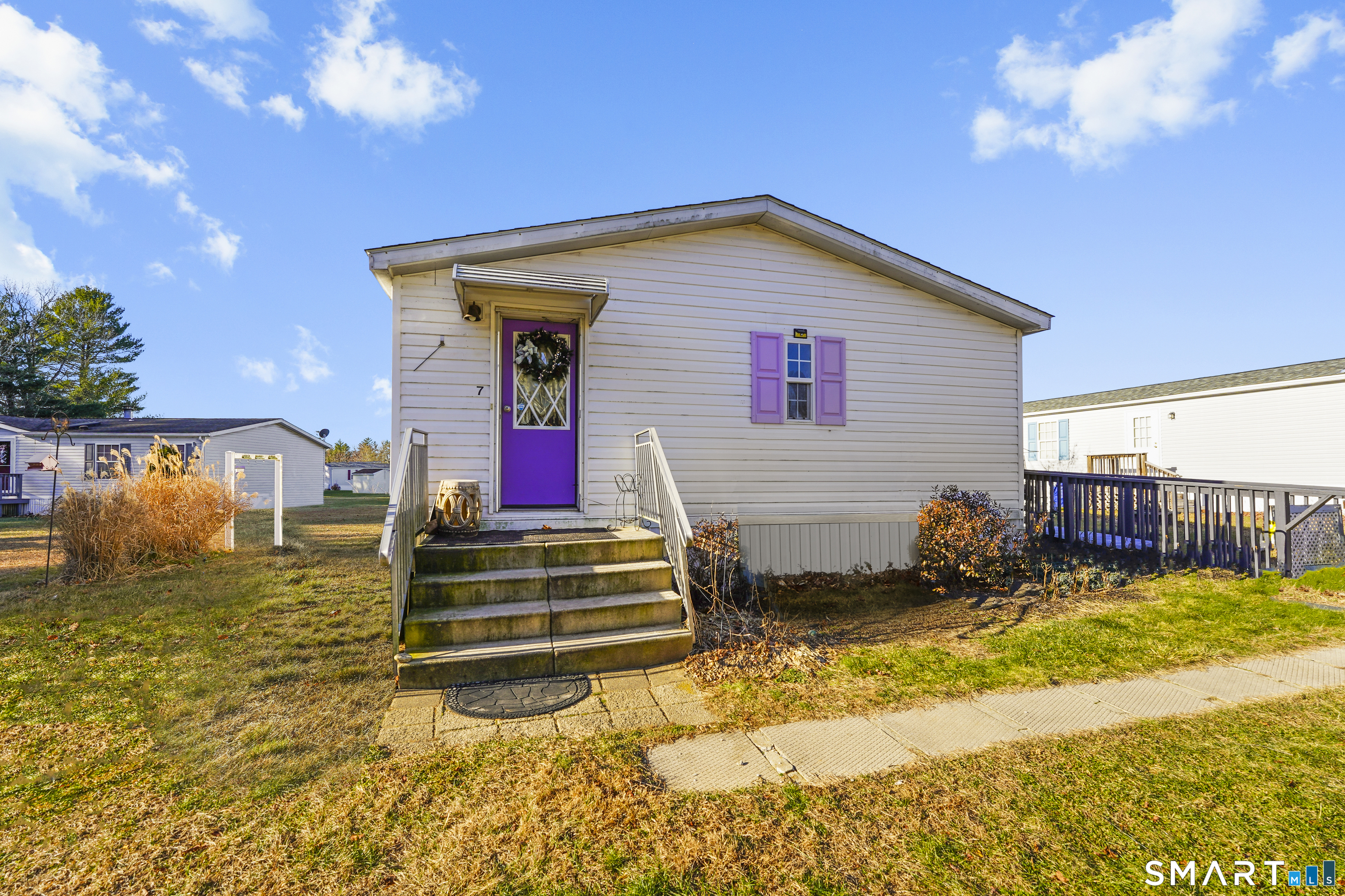7 Jessie Lane Windham, CT 06256 - Photo 1 of 34 a view of a house with wooden fence