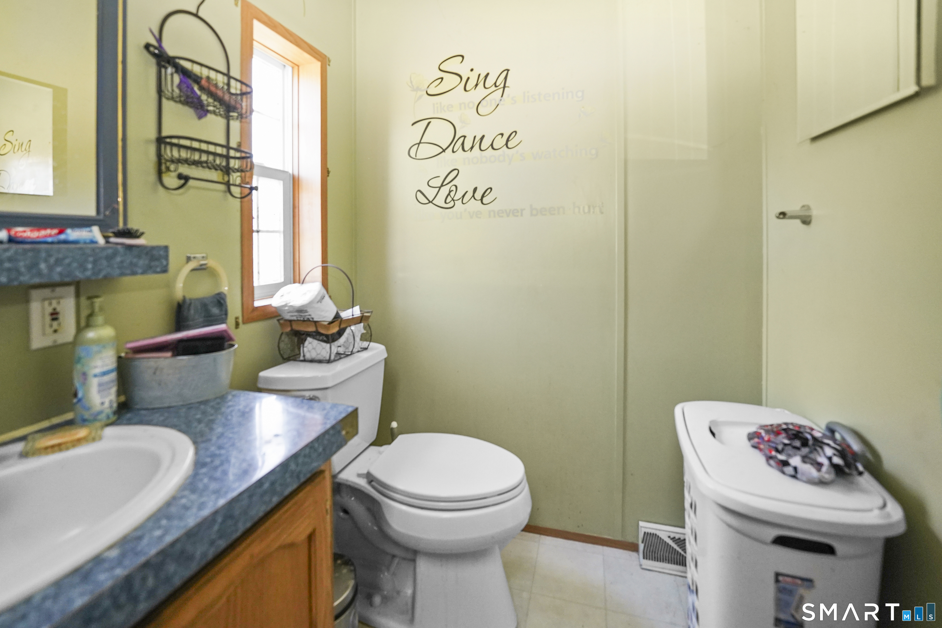 7 Jessie Lane Windham, CT 06256 - Photo 12 of 34 a bathroom with a granite countertop toilet sink and mirror