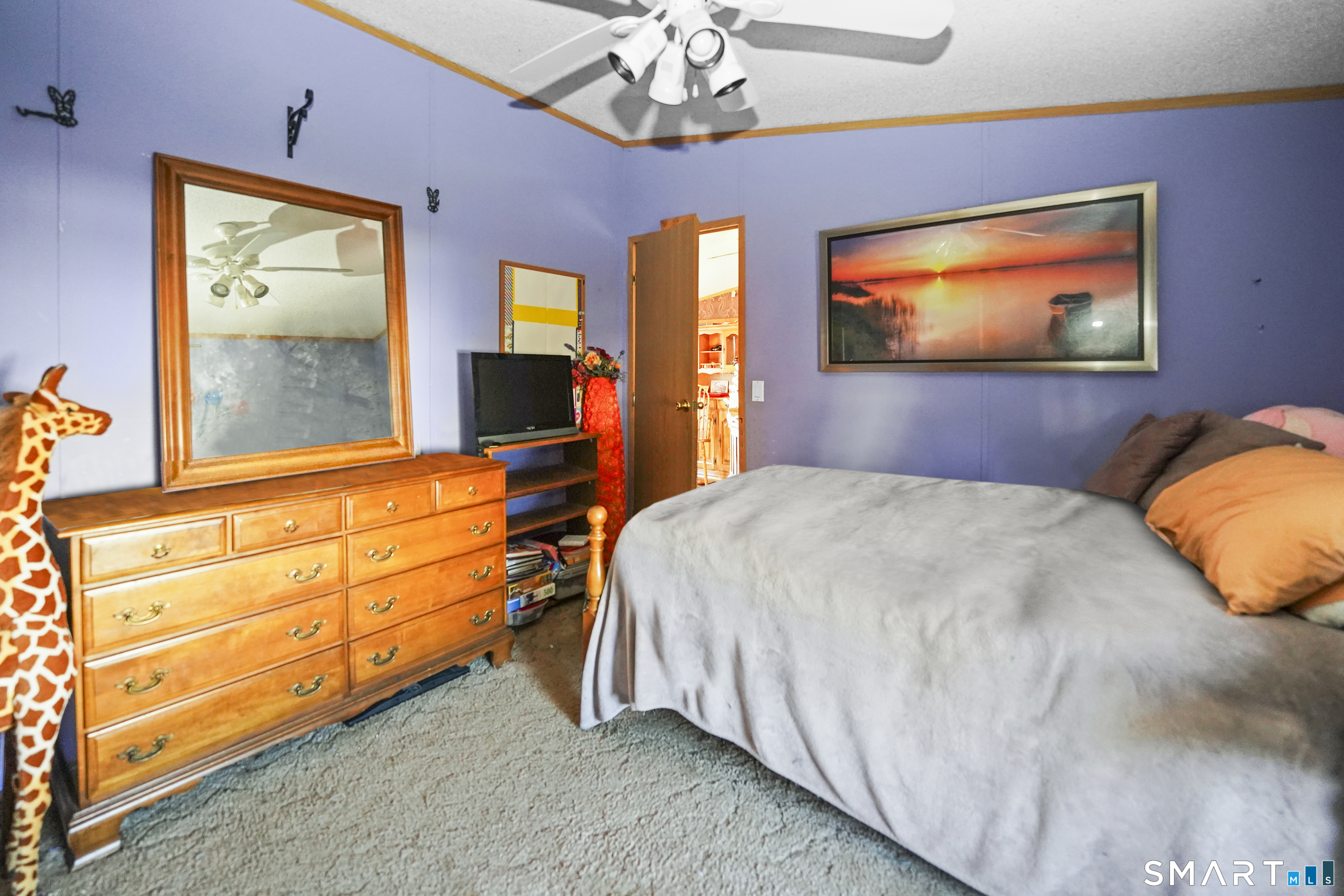 7 Jessie Lane Windham, CT 06256 - Photo 16 of 34 a bedroom with a bed and a flat screen tv