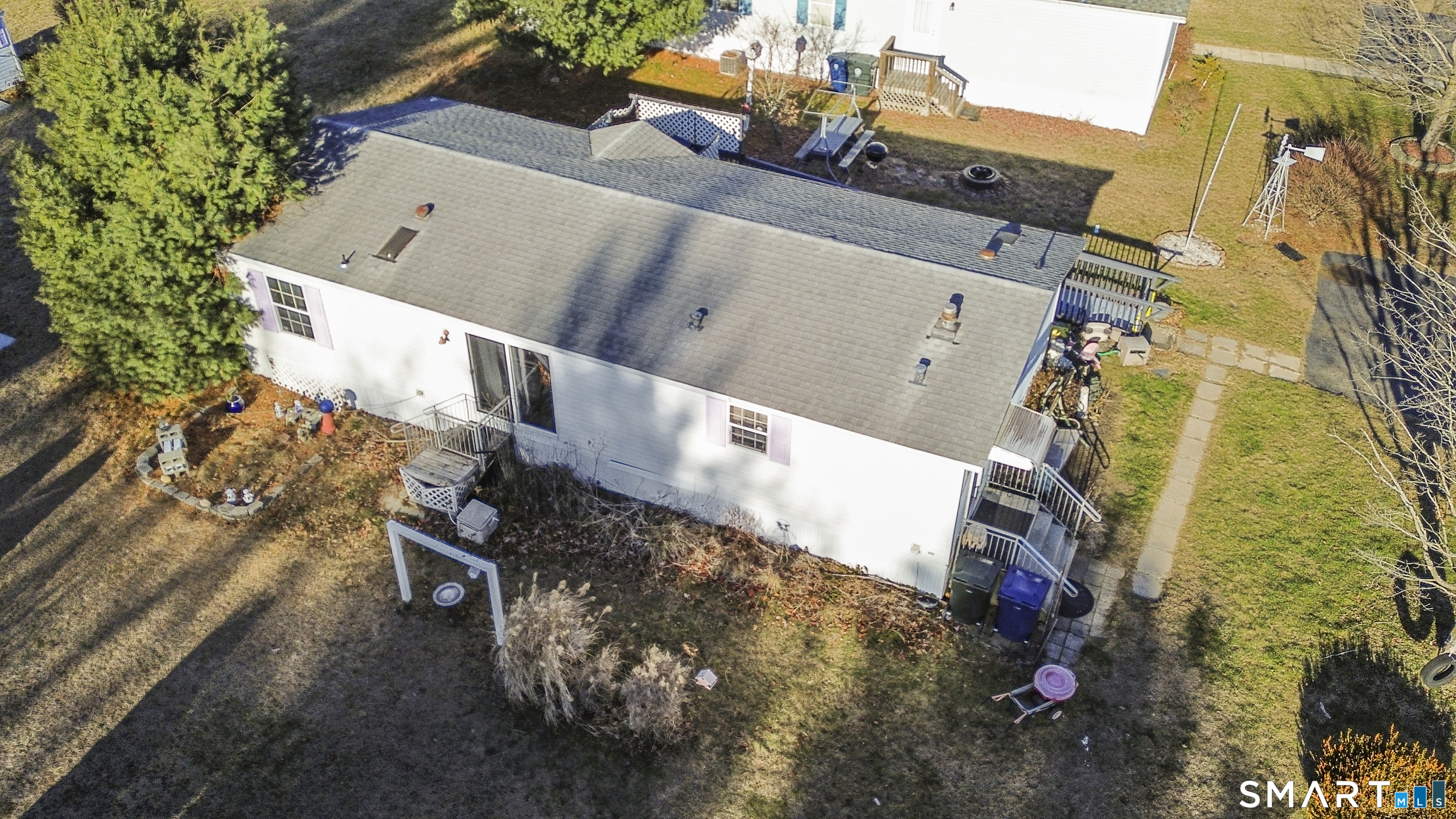 7 Jessie Lane Windham, CT 06256 - Photo 21 of 34 an aerial view of a house with a yard and wooden deck