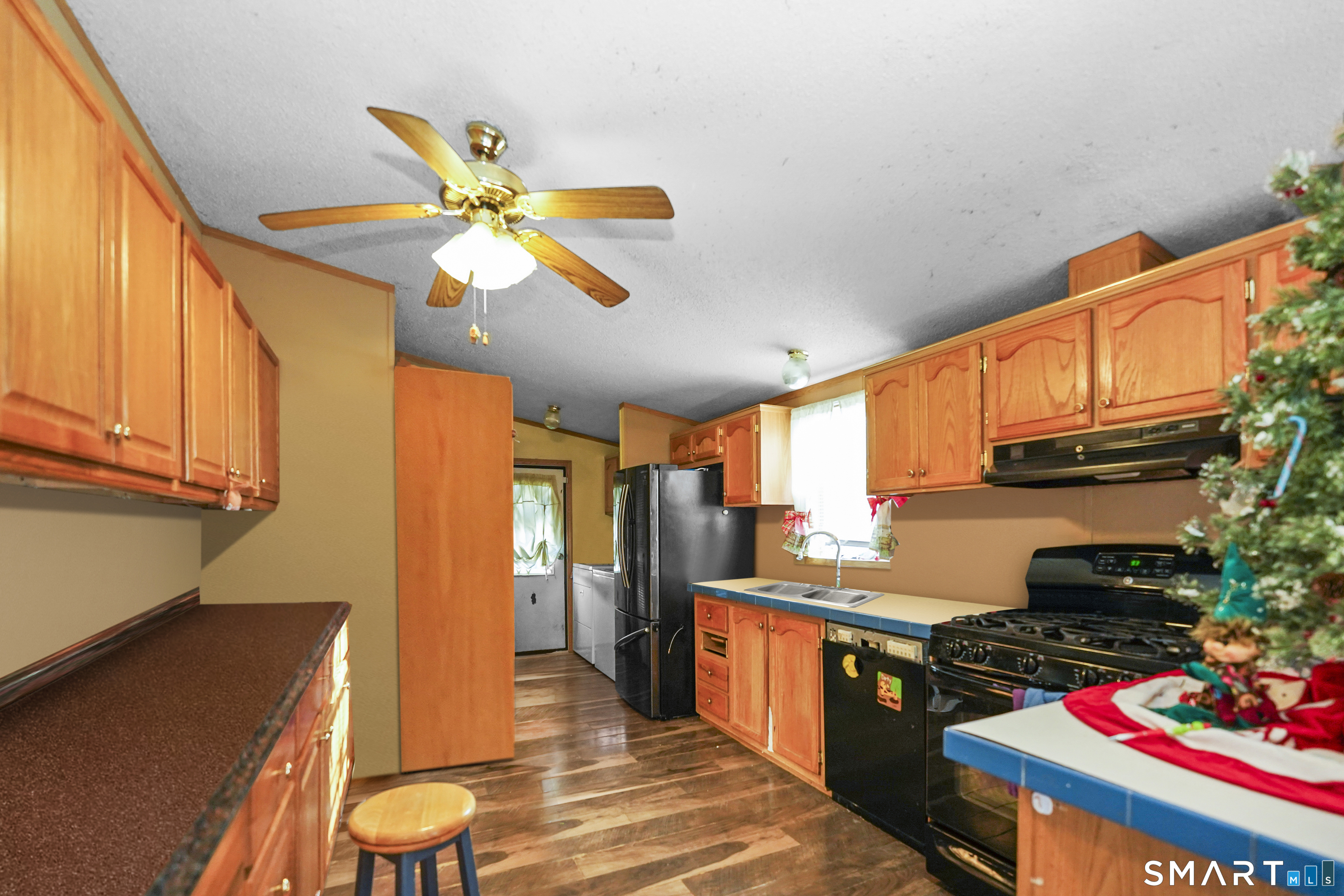 7 Jessie Lane Windham, CT 06256 - Photo 3 of 34 a kitchen with stainless steel appliances granite countertop a sink a stove and a refrigerator
