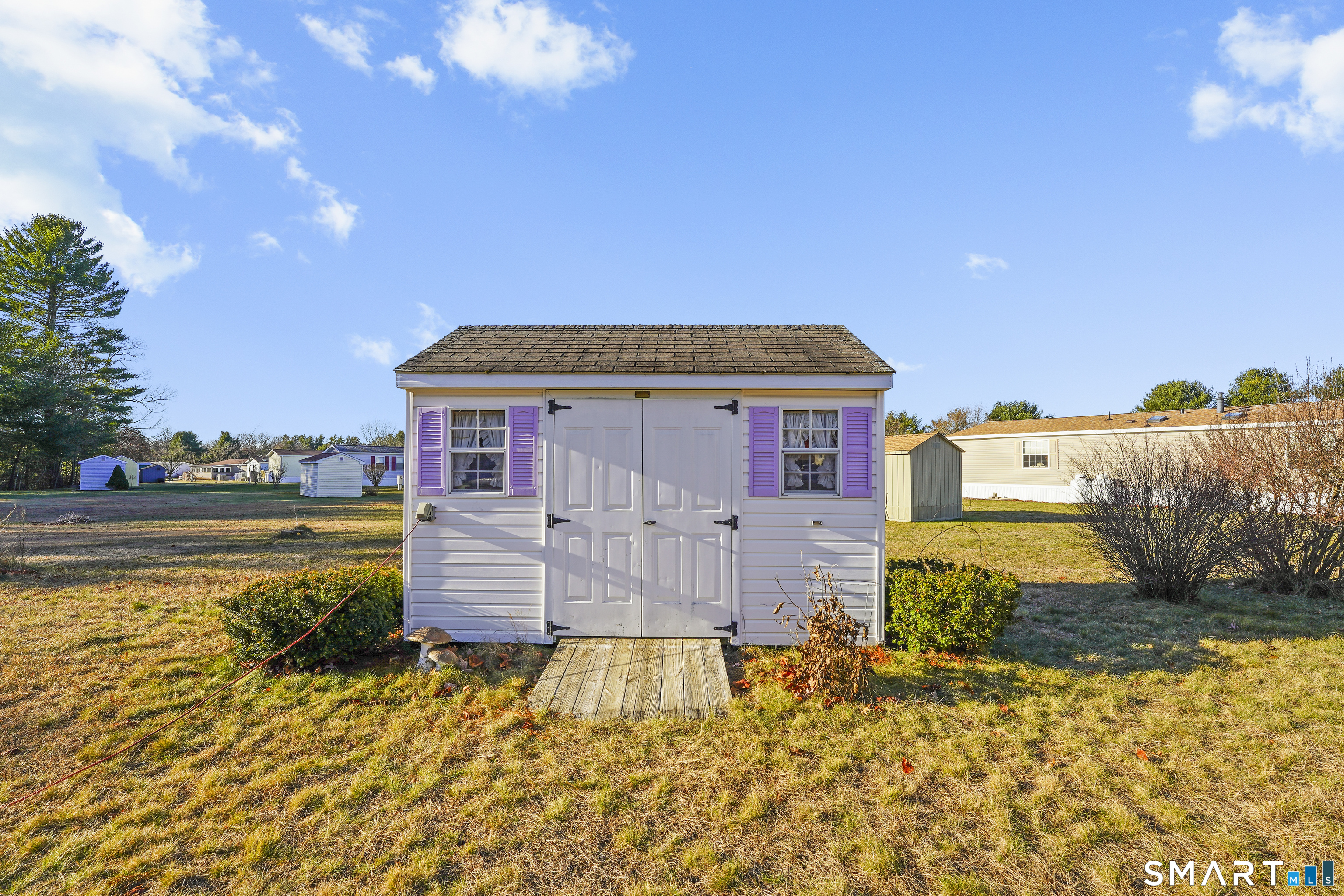 7 Jessie Lane Windham, CT 06256 - Photo 31 of 34 a front view of a house with a yard