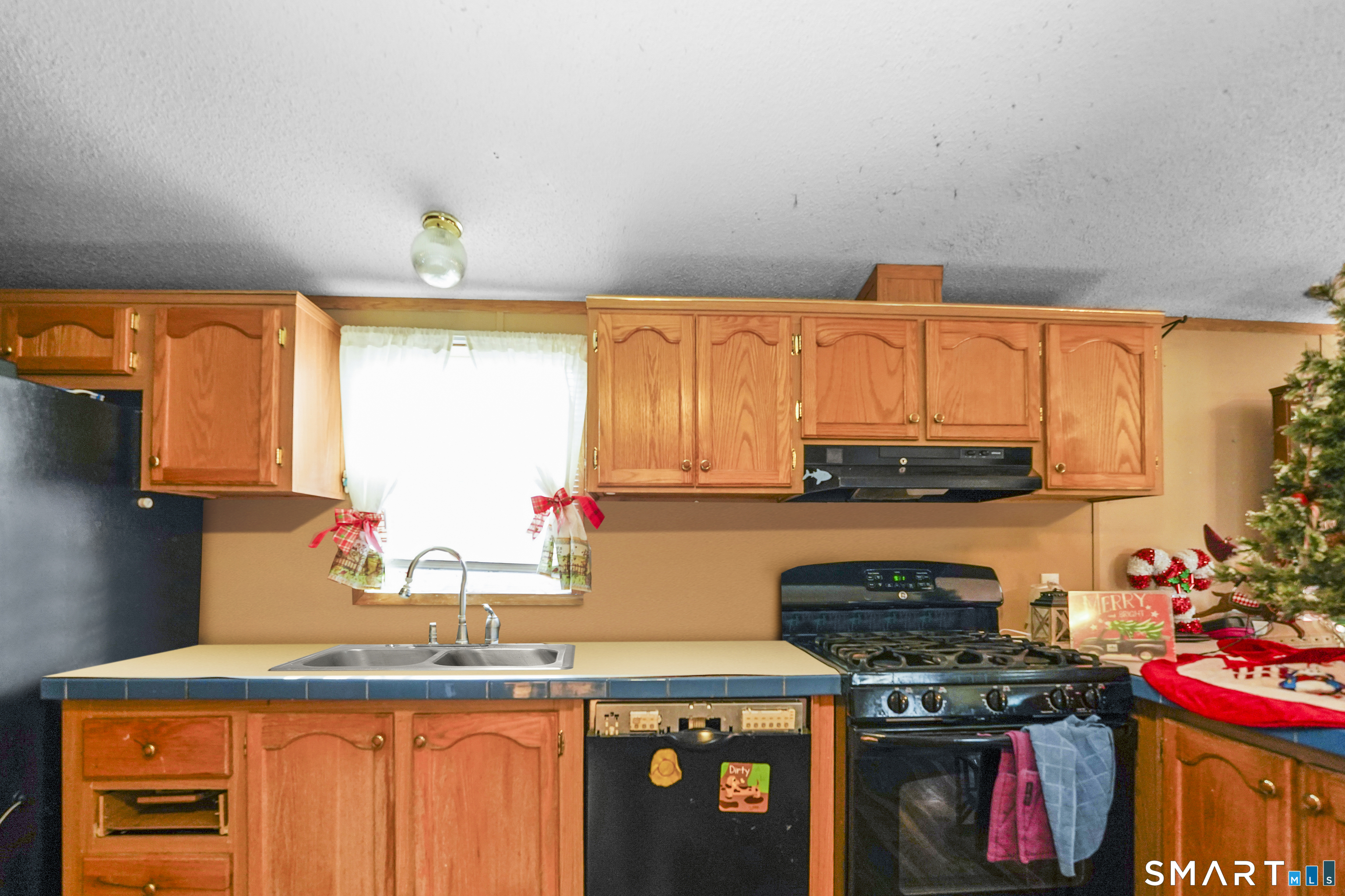 7 Jessie Lane Windham, CT 06256 - Photo 5 of 34 a kitchen with stainless steel appliances granite countertop a stove a sink and a microwave