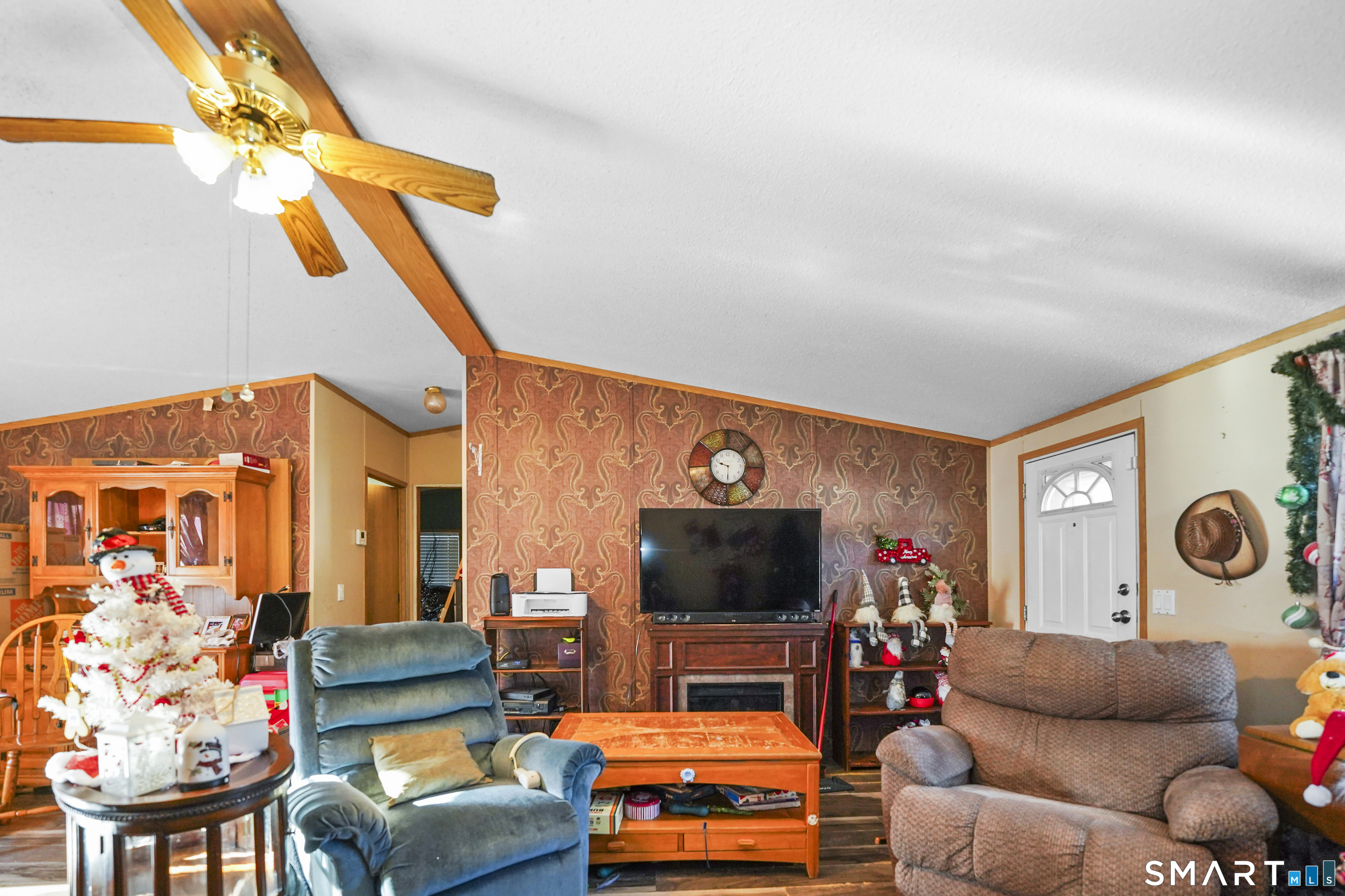 7 Jessie Lane Windham, CT 06256 - Photo 9 of 34 a living room with furniture and a flat screen tv