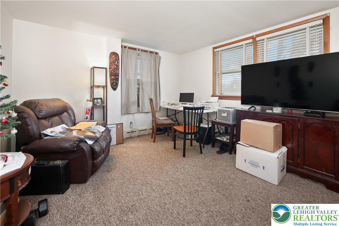2401 Birch Street Wilson, PA 18042 - Photo 11 of 37 a living room with furniture and a flat screen tv