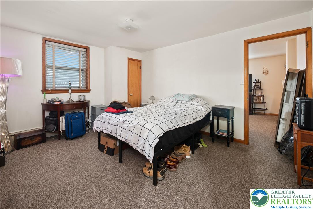 2401 Birch Street Wilson, PA 18042 - Photo 13 of 37 a bedroom with a bed and a table in it