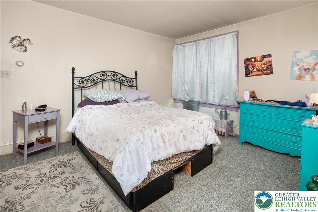 2401 Birch Street Wilson, PA 18042 - Photo 18 of 37 a bedroom with a bed chair and a window