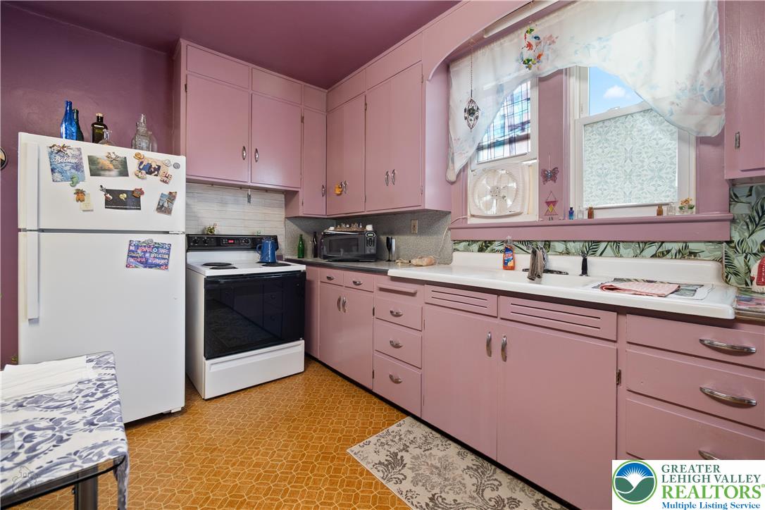 2401 Birch Street Wilson, PA 18042 - Photo 20 of 37 a kitchen with cabinets appliances and a window