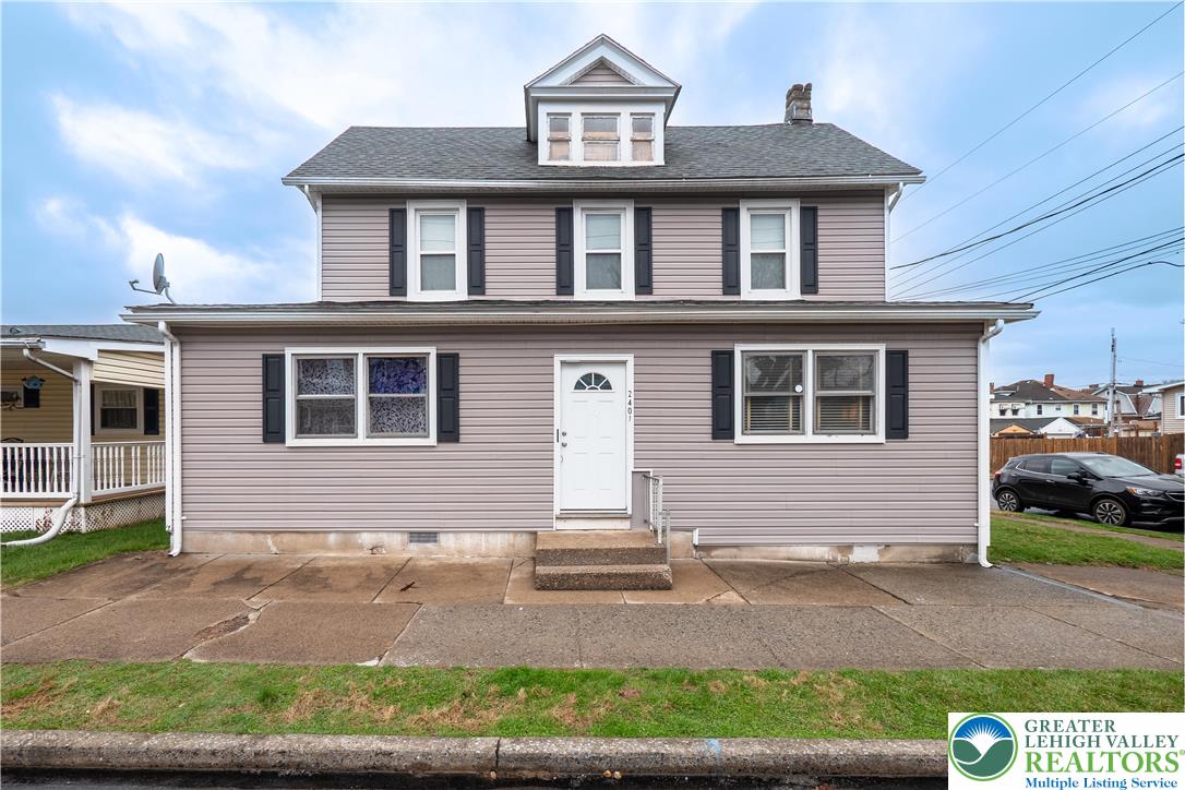 2401 Birch Street Wilson, PA 18042 - Photo 2 of 37 a front view of a house with a yard and garage