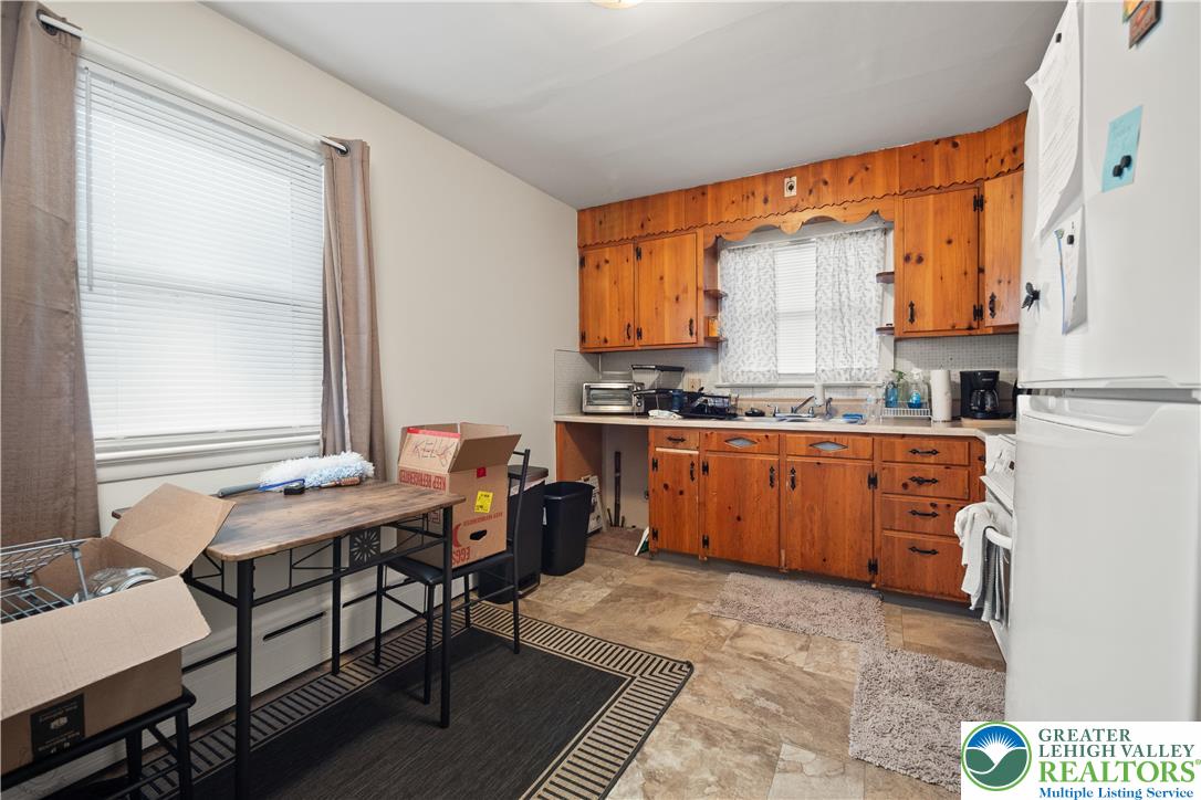 2401 Birch Street Wilson, PA 18042 - Photo 24 of 37 a kitchen with a stove a sink and a refrigerator