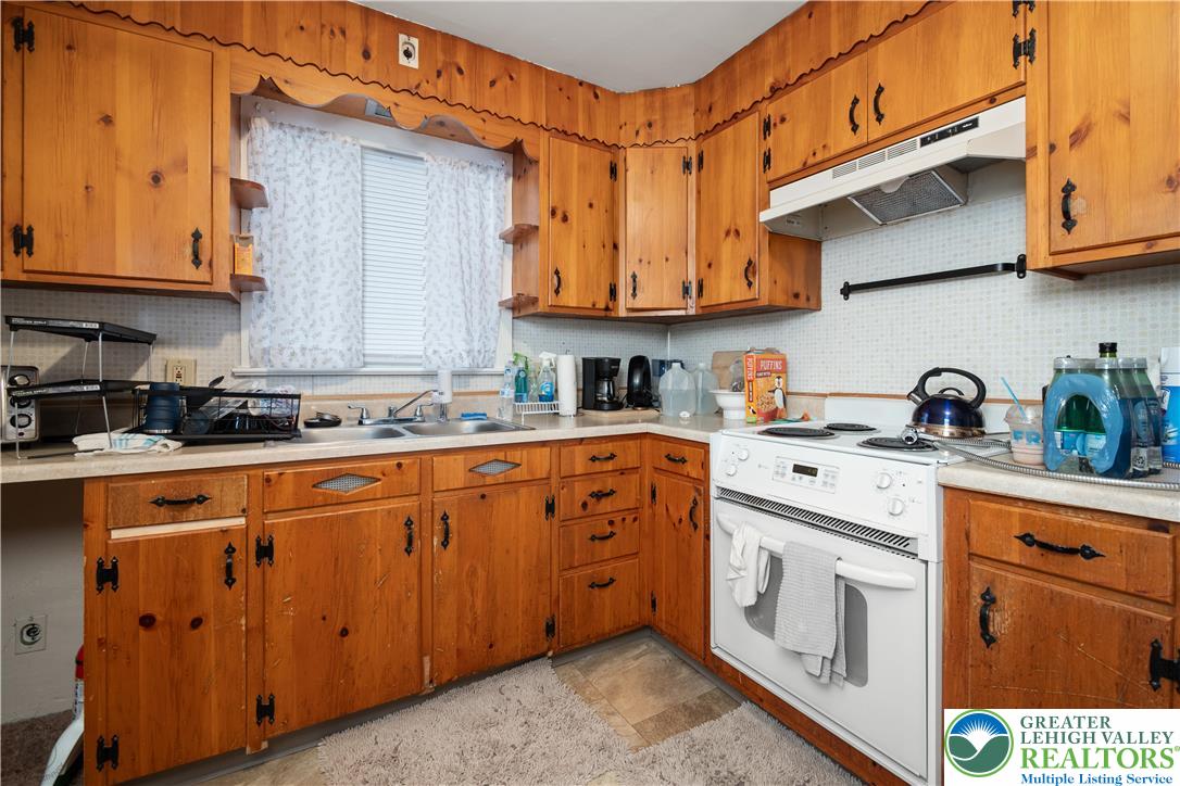 2401 Birch Street Wilson, PA 18042 - Photo 25 of 37 a kitchen with stainless steel appliances granite countertop a sink and cabinets