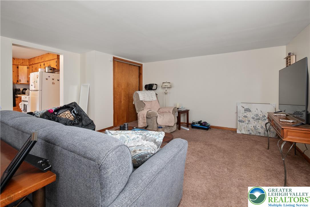 2401 Birch Street Wilson, PA 18042 - Photo 28 of 37 a living room with furniture a window and a flat screen tv