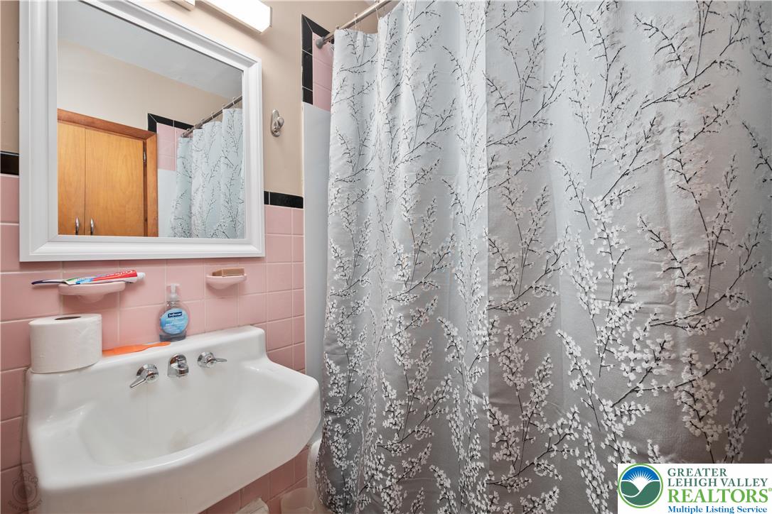2401 Birch Street Wilson, PA 18042 - Photo 29 of 37 a bathroom with a sink and a mirror
