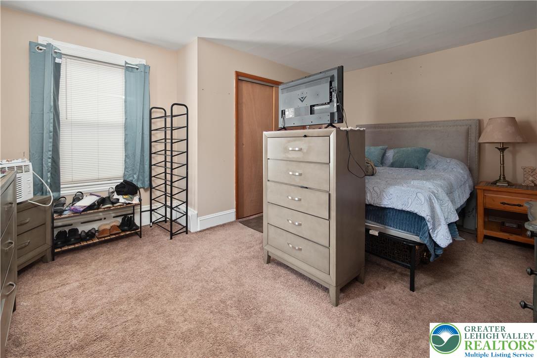 2401 Birch Street Wilson, PA 18042 - Photo 31 of 37 a bedroom with a bed and a chair