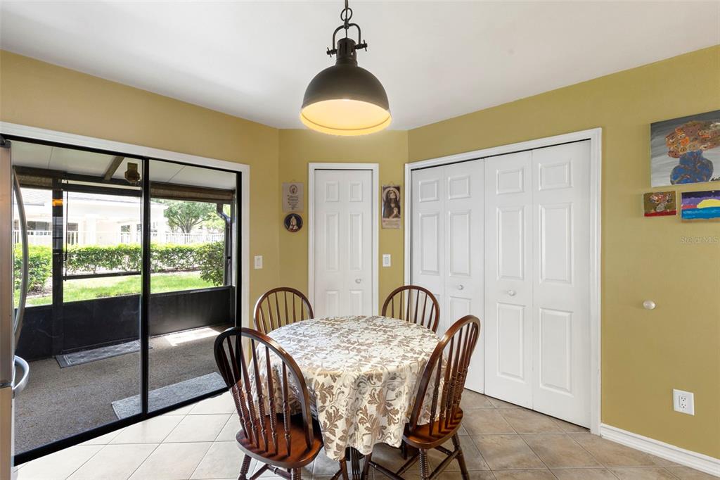 5100 Burchette Road, Unit 2701 Tampa, FL 33647 - Photo 12 of 38 a dining room with furniture and window