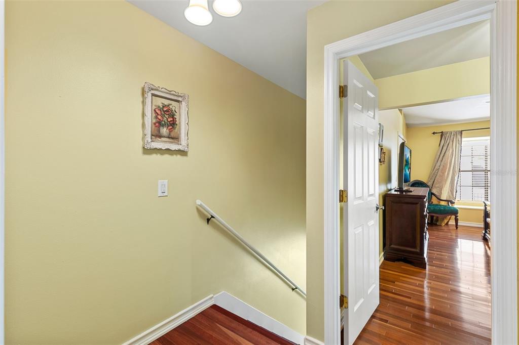 5100 Burchette Road, Unit 2701 Tampa, FL 33647 - Photo 15 of 38 a view of a hallway with wooden floor and dining room