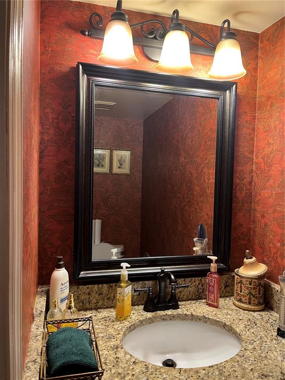 5100 Burchette Road, Unit 2701 Tampa, FL 33647 - Photo 18 of 38 a bathroom with a sink and a mirror