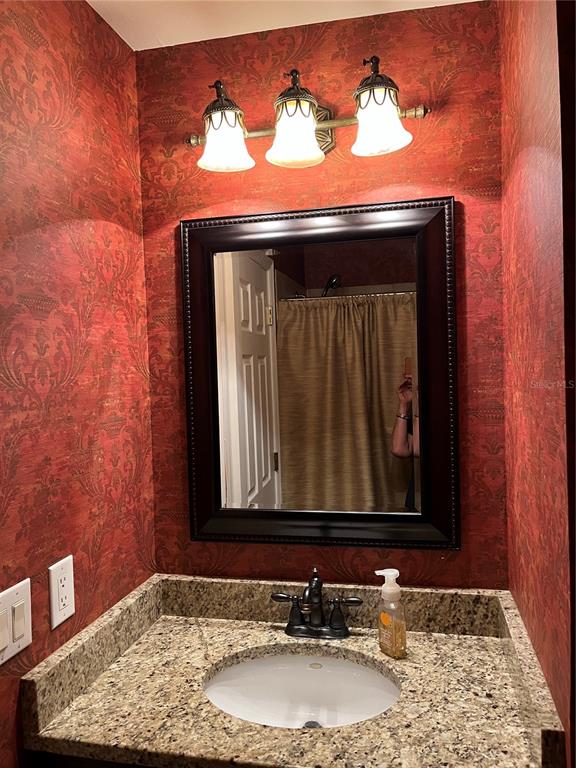 5100 Burchette Road, Unit 2701 Tampa, FL 33647 - Photo 19 of 38 a bathroom with a sink and a mirror