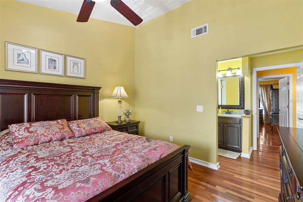 5100 Burchette Road, Unit 2701 Tampa, FL 33647 - Photo 22 of 38 a bedroom with a bed and a chandelier