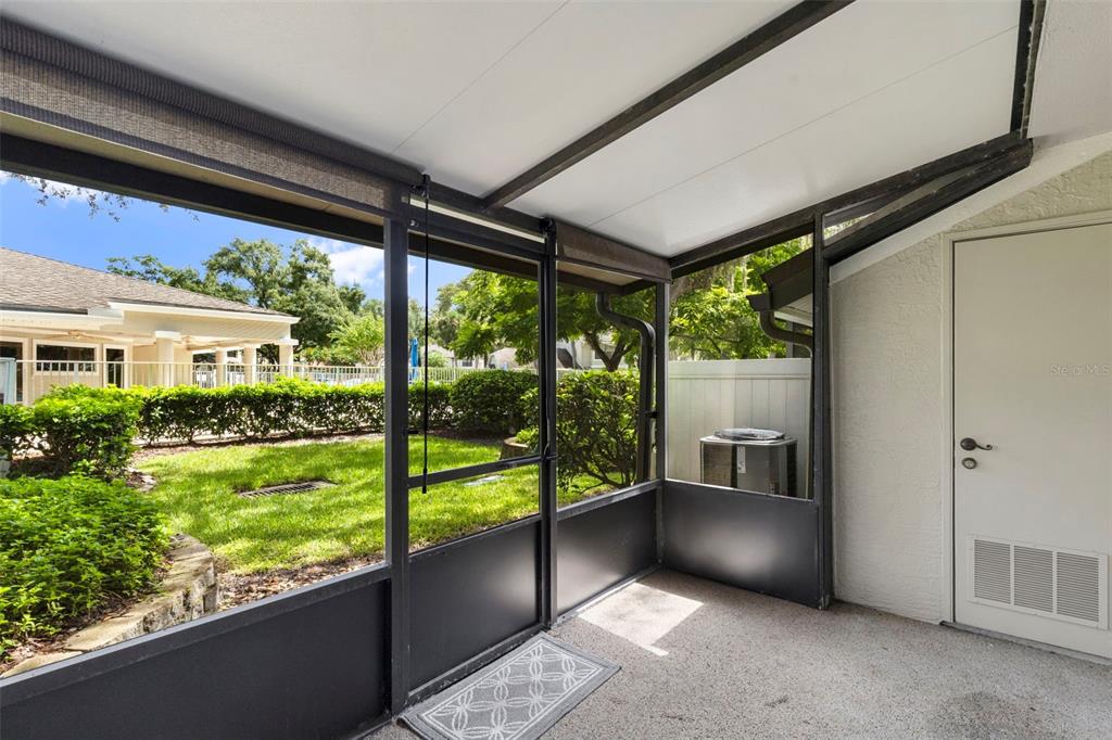 5100 Burchette Road, Unit 2701 Tampa, FL 33647 - Photo 28 of 38 a view of an outdoor kitchen with a large window