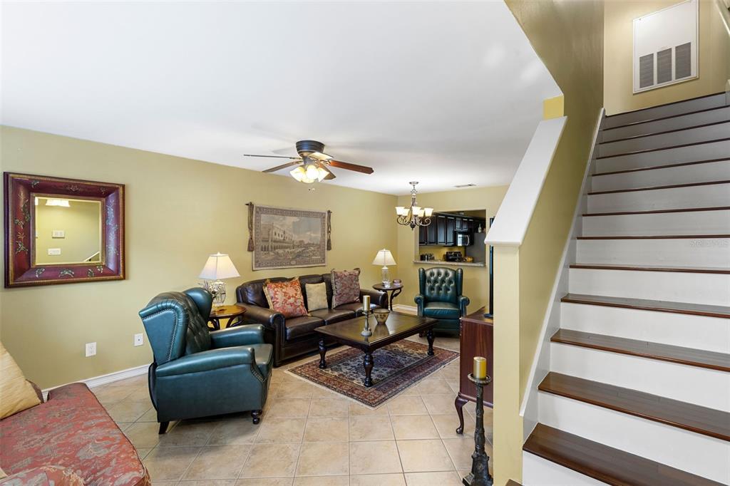 5100 Burchette Road, Unit 2701 Tampa, FL 33647 - Photo 6 of 38 a living room with furniture and stairs