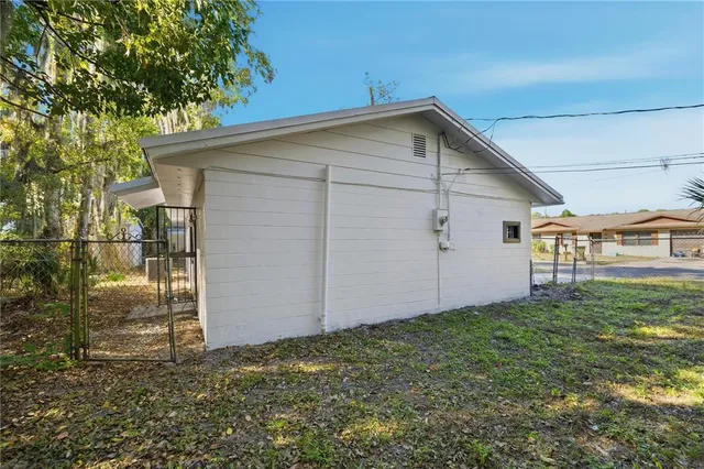 a view of backyard with garage