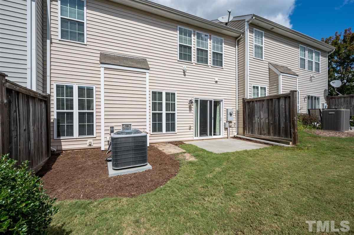 8705 Wild Magnolia Drive Raleigh, NC 27617 - Photo 15 of 15 a view of a house with backyard and a garden