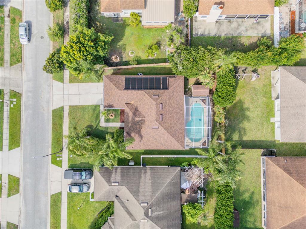 12232 Bronson Way Orlando, FL 32824 - Photo 25 of 32 an aerial view of a house with a garden and plants