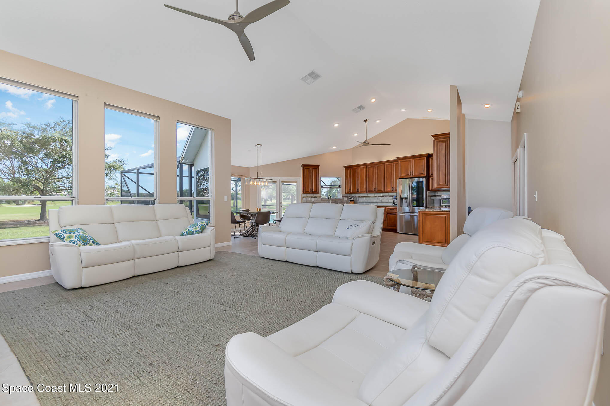 689 Spring Lake Drive Melbourne, FL 32940 - Photo 19 of 49 a living room with furniture and a large window