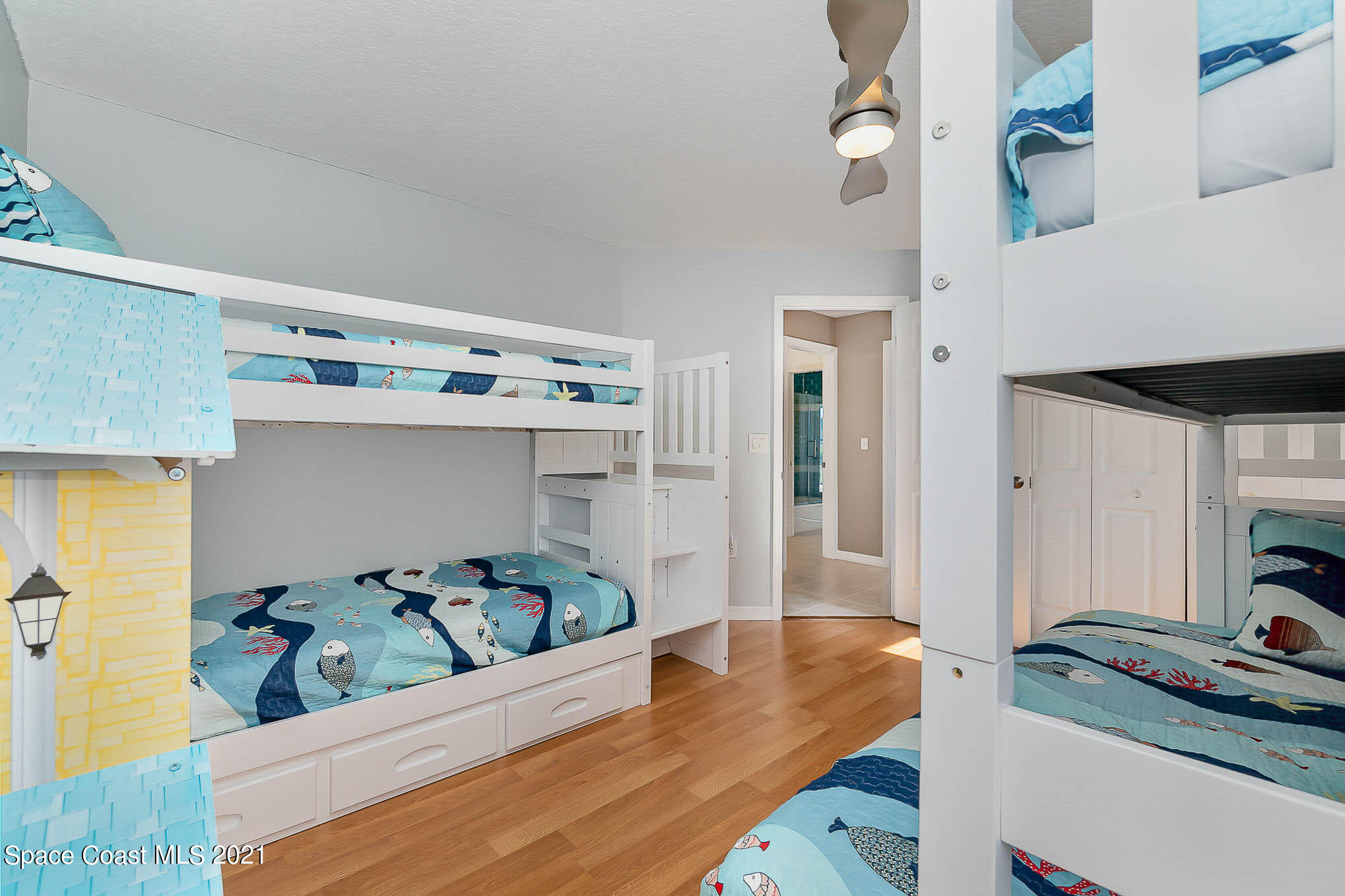 689 Spring Lake Drive Melbourne, FL 32940 - Photo 34 of 49 a living room with furniture and a table