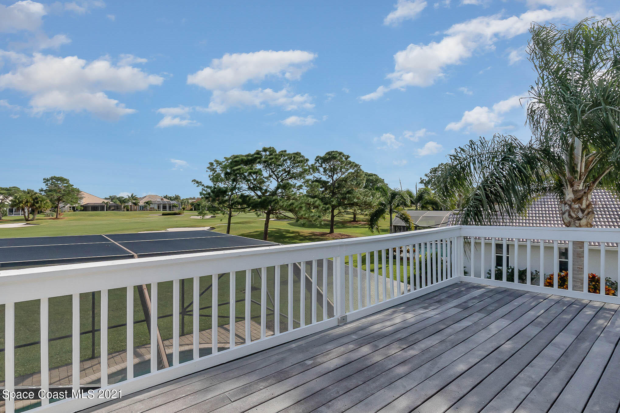 689 Spring Lake Drive Melbourne, FL 32940 - Photo 39 of 49 a view of a wooden roof deck