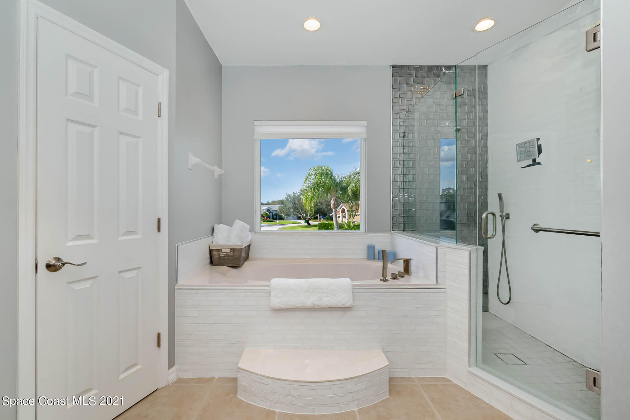 689 Spring Lake Drive Melbourne, FL 32940 - Photo 42 of 49 a bathroom with a toilet and a shower