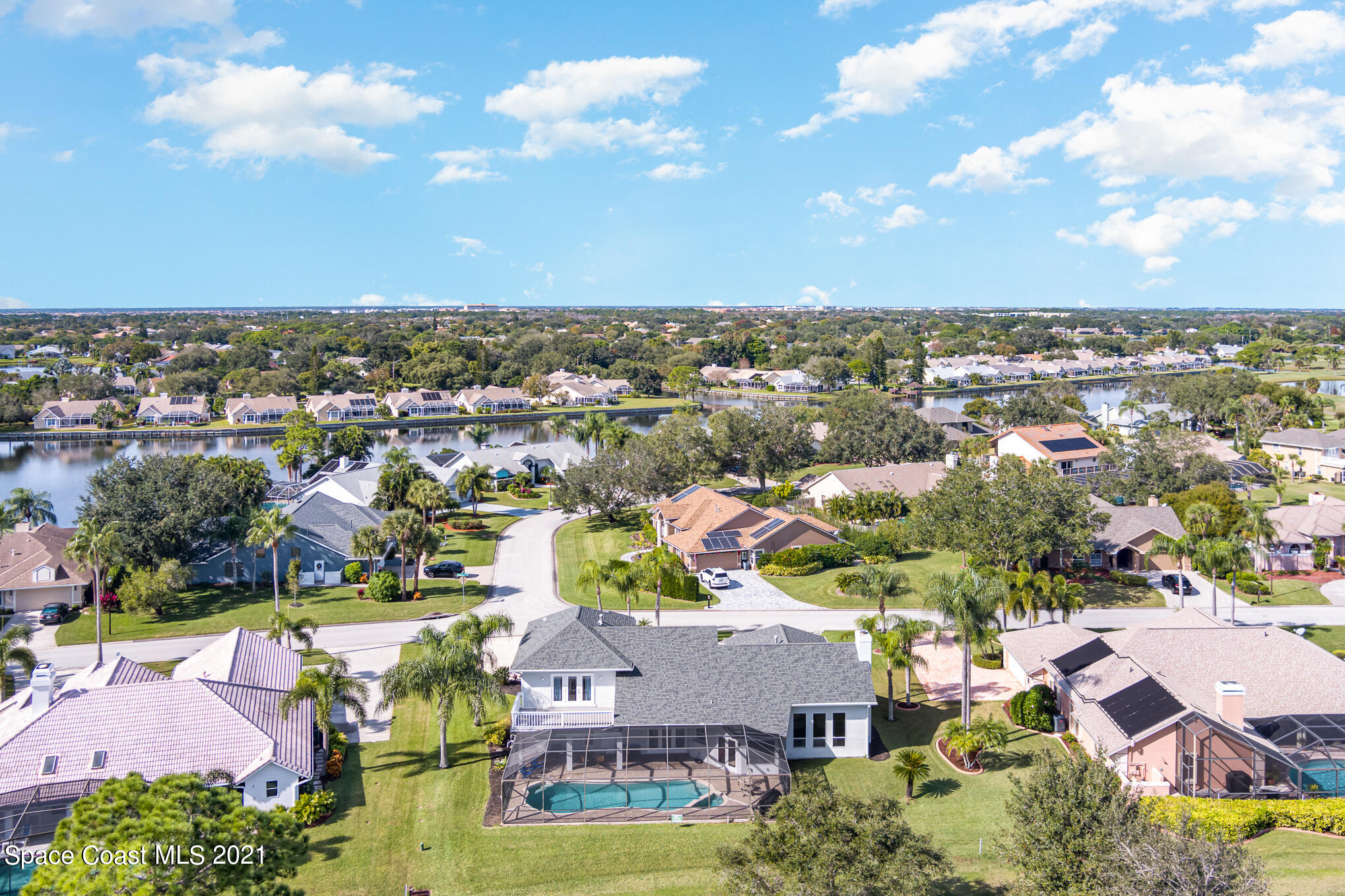 689 Spring Lake Drive Melbourne, FL 32940 - Photo 44 of 49 an aerial view of residential houses with outdoor space and ocean view