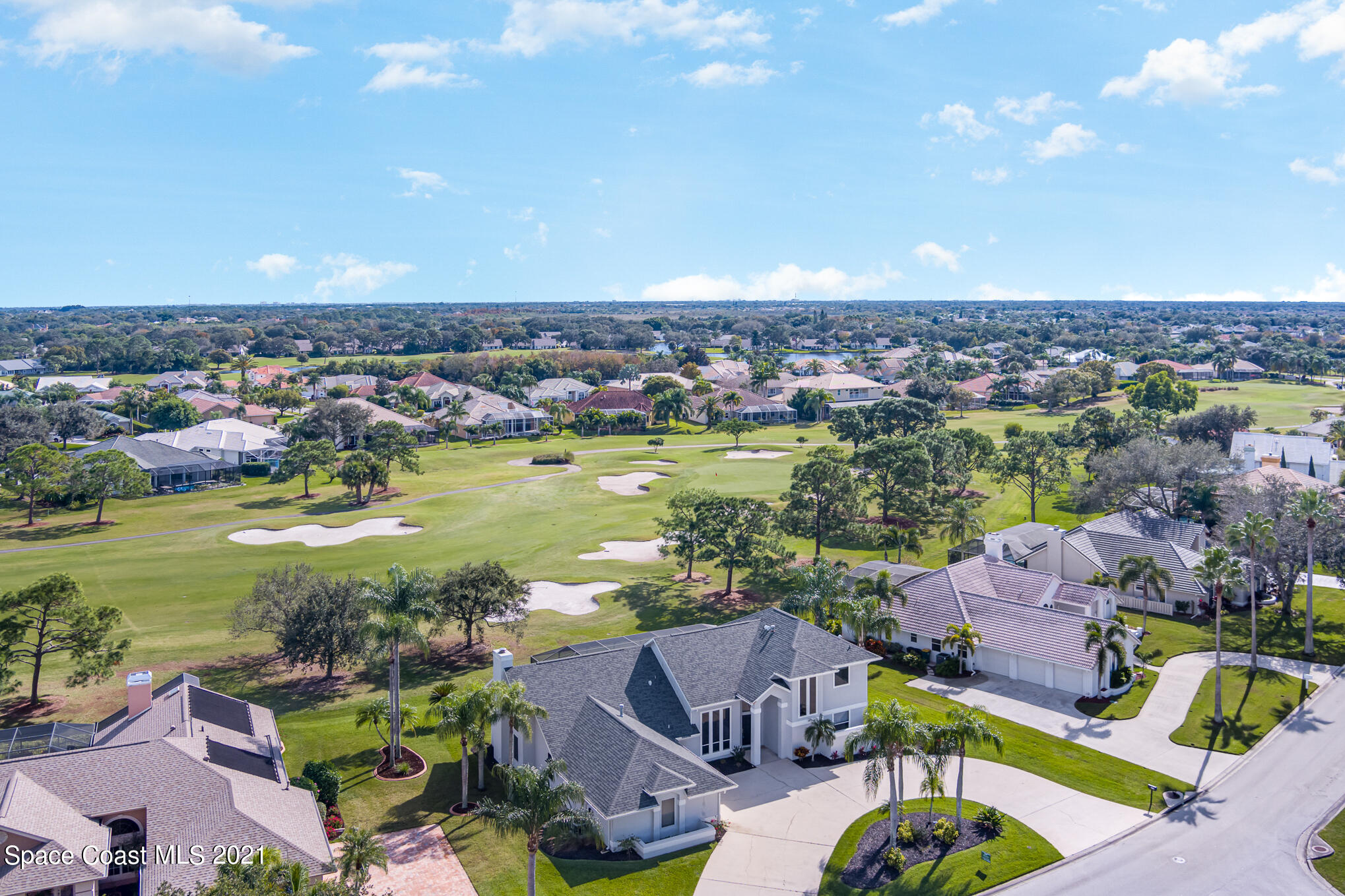 689 Spring Lake Drive Melbourne, FL 32940 - Photo 45 of 49 an aerial view of a houses with a swimming pool