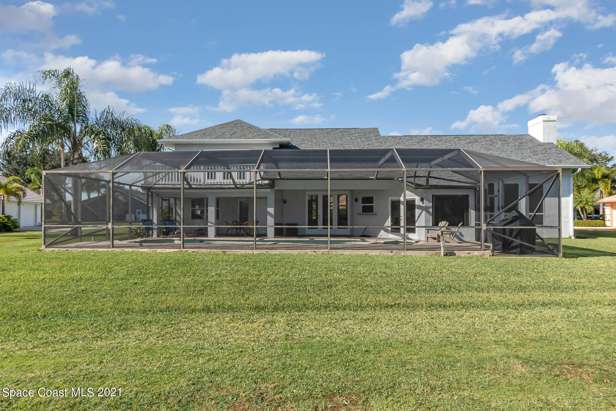 689 Spring Lake Drive Melbourne, FL 32940 - Photo 47 of 49 a front view of house with yard patio and patio