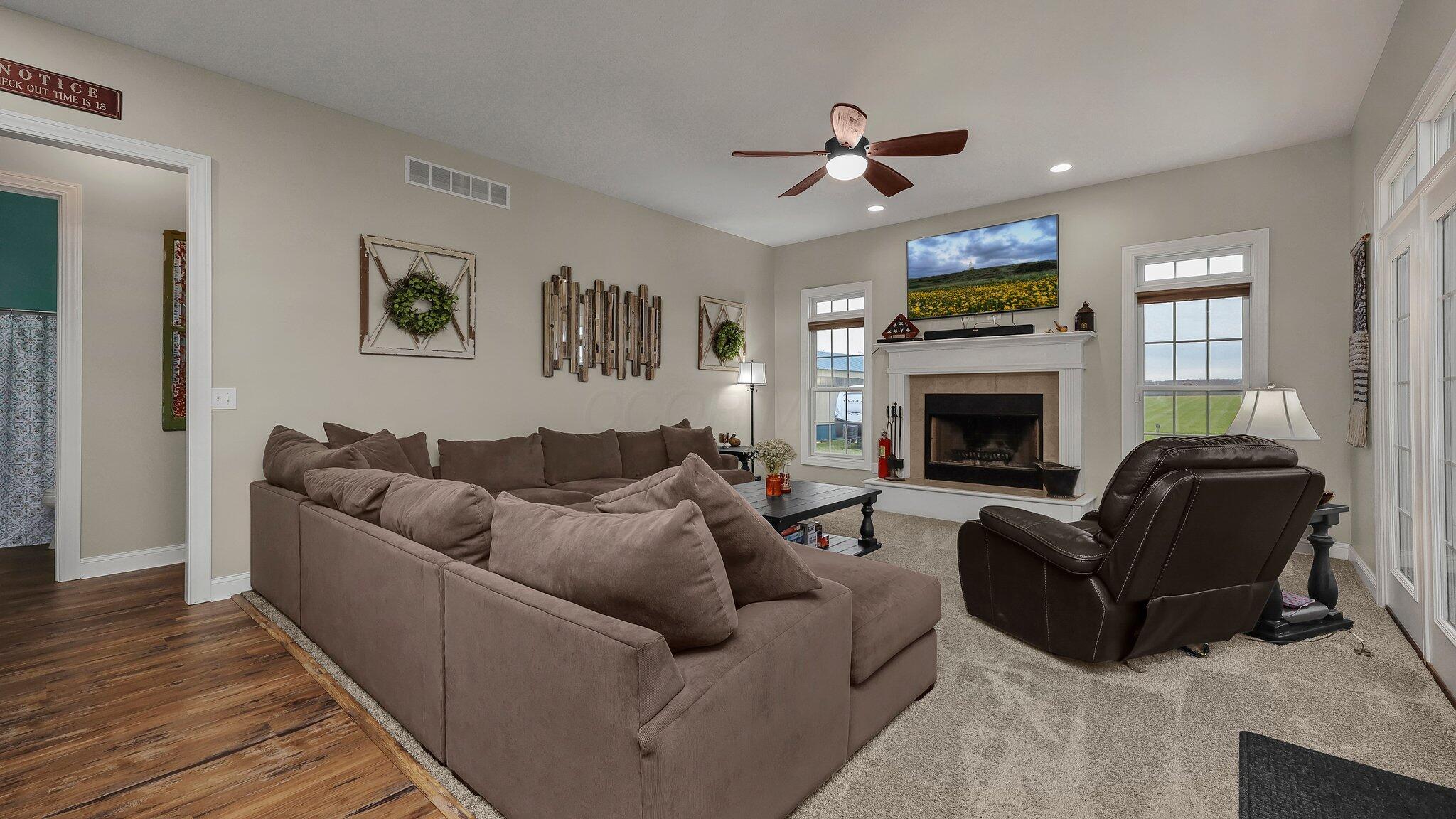21729 Liberty West Road Raymond, OH 43067 - Photo 17 of 50 Sunny greatroom in back with fireplace