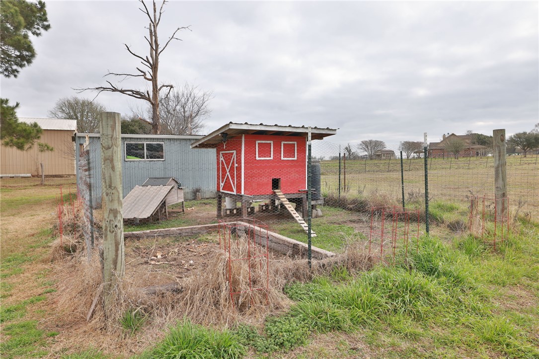 7474 Welch Road Bryan, TX 77808 - Photo 21 of 27 a house view with a backyard space