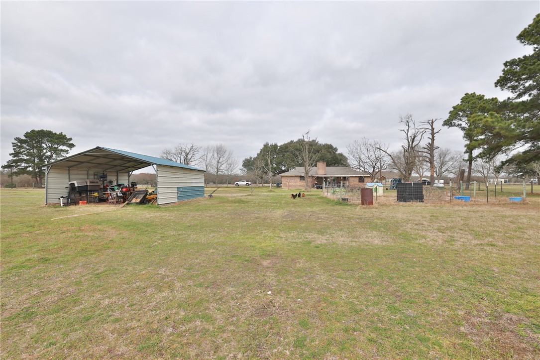 7474 Welch Road Bryan, TX 77808 - Photo 22 of 27 a aerial view of residential houses with outdoor space