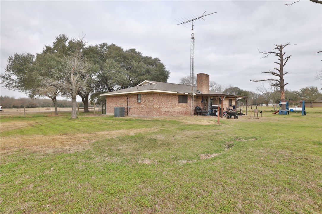 7474 Welch Road Bryan, TX 77808 - Photo 27 of 27 a front view of a house with a yard