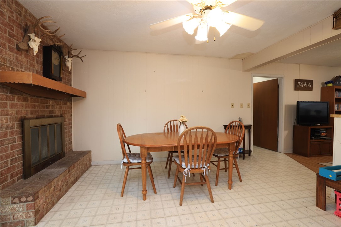 7474 Welch Road Bryan, TX 77808 - Photo 8 of 27 a view of a dining room with furniture and chandelier