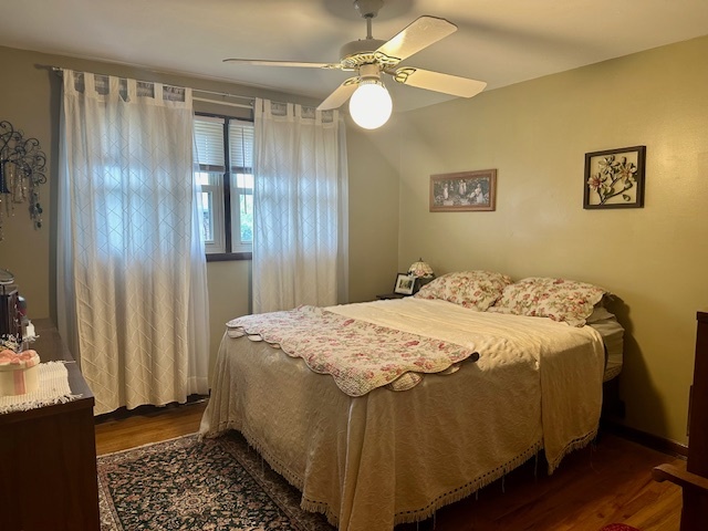 1364 West Tower Road Kankakee, IL 60901 - Photo 11 of 18 a bedroom with a bed and a chandelier