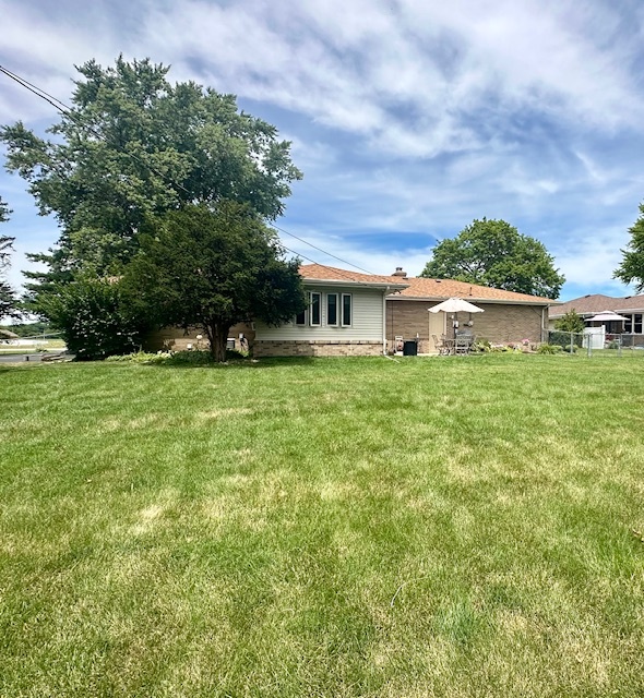 1364 West Tower Road Kankakee, IL 60901 - Photo 17 of 18 a swimming pool with trees in the background