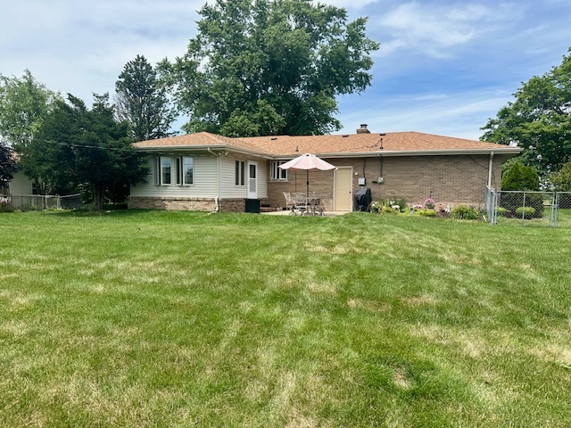 1364 West Tower Road Kankakee, IL 60901 - Photo 18 of 18 a front view of a house with a garden