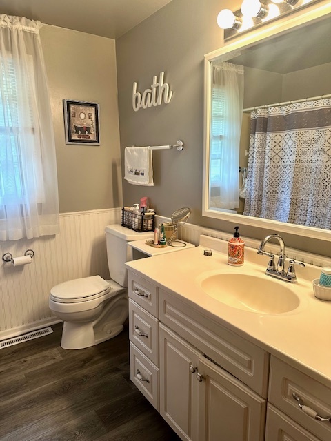1364 West Tower Road Kankakee, IL 60901 - Photo 10 of 18 a bathroom with a toilet a sink and mirror